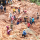 In Chimanimani, Zimbabwe, a family digs for their son in the mud after Cyclone Idai hit.